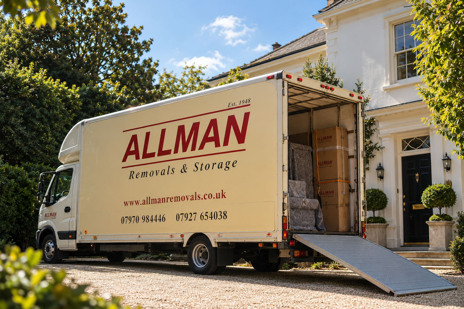 Allman Removals & Storage lorry parked outside a family home with its ramp down